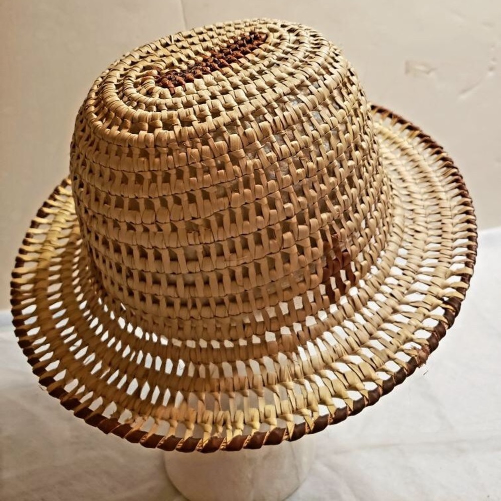 Woven hat is hand made and is 8 inches